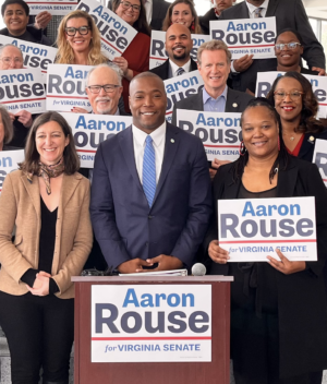 Aaron Rouse in group photo with people holding "Aaron Rouse for Virginia Senate" signs