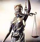 Photo of statue of blindfolded Lady Justice holding the scales of justice
