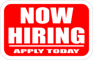 Graphic of a sign with a red background and white letters reading "Now Hiring — Apply Today"