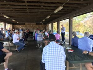 Crowd of Charlottesville and Albemarle County Dems on Sunday October 28 2023 listening to Senator Mark Warner at a Pen Park get-out-the-vote pre-canvass lunch