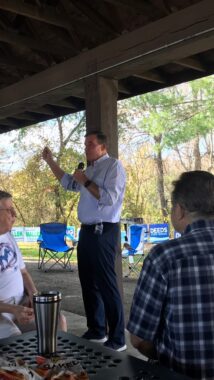 Senator Mark Warner speaking to a crowd of Charlottesville and Albemarle County Dems on Sunday October 28 2023 at a Pen Park get-out-the-vote pre-canvass lunch
