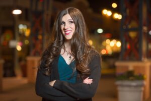 Photo of 13th District State Senator Danica Roem in an urban nighttime street scene in Gainesville.