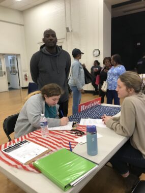 People sign up to become registered voters at Carver Recreation Center in Charlottesville