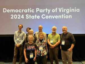 An official portrait of Charlottesville delegates, men and women, at the state convention to choose electors and delegates in Richmond, July 2024